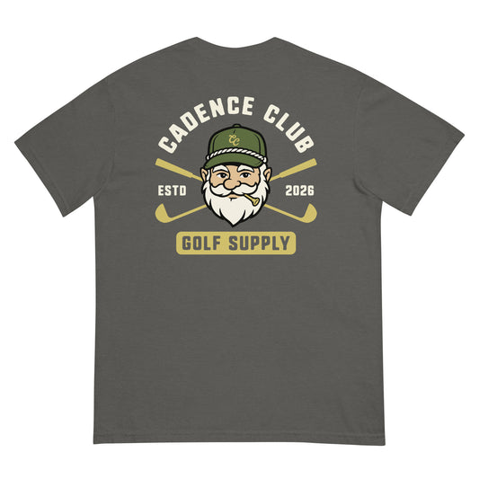 A dark gray t-shirt shown from the back, featuring a graphic print of a bearded man in a green cap with crossed golf clubs and the text 'CADENCE CLUB ESTD 2026 GOLF SUPPLY'.