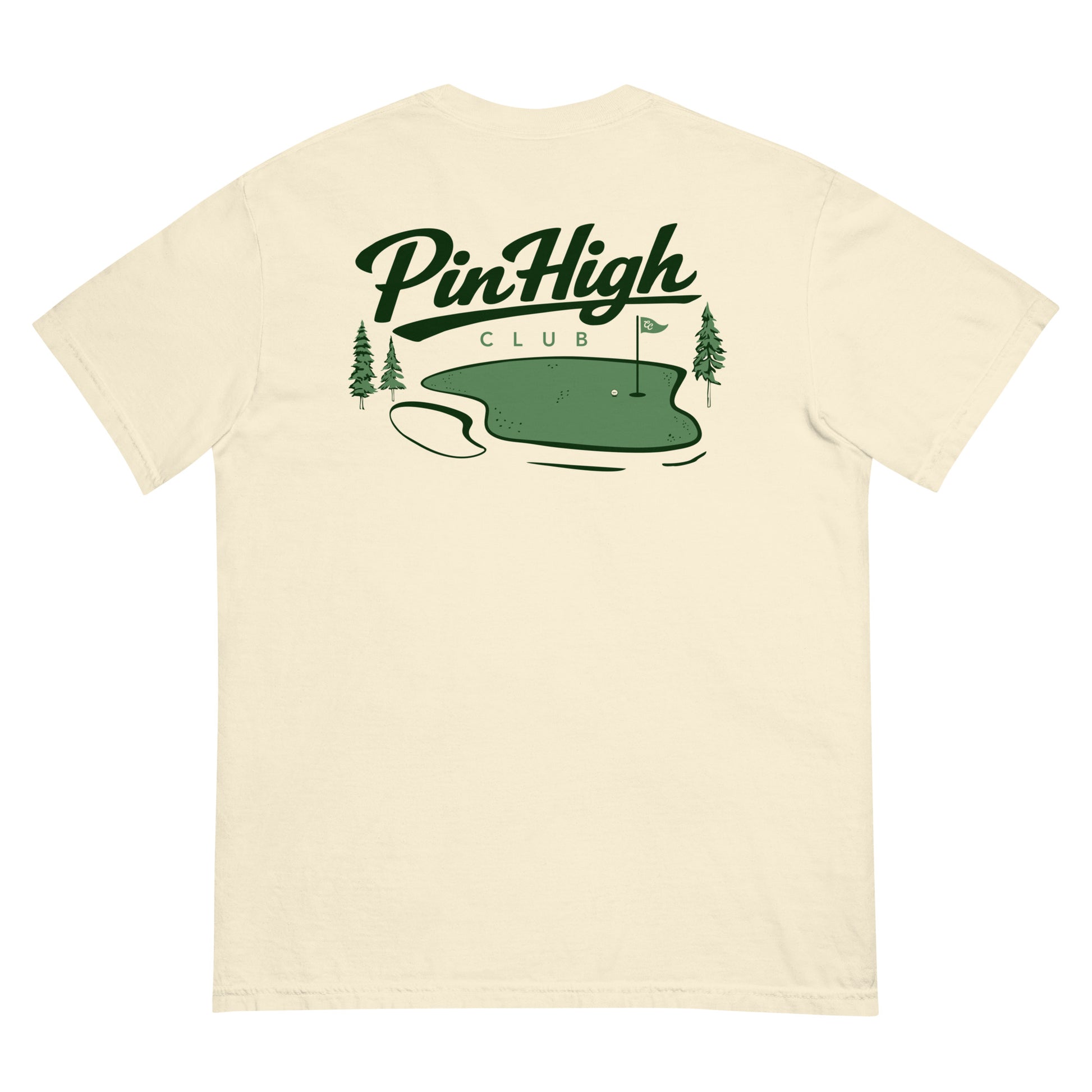 A cream-colored short-sleeve t-shirt shown from the back, featuring a green graphic of a golf green with pine trees and the text 'PinHigh CLUB'.
