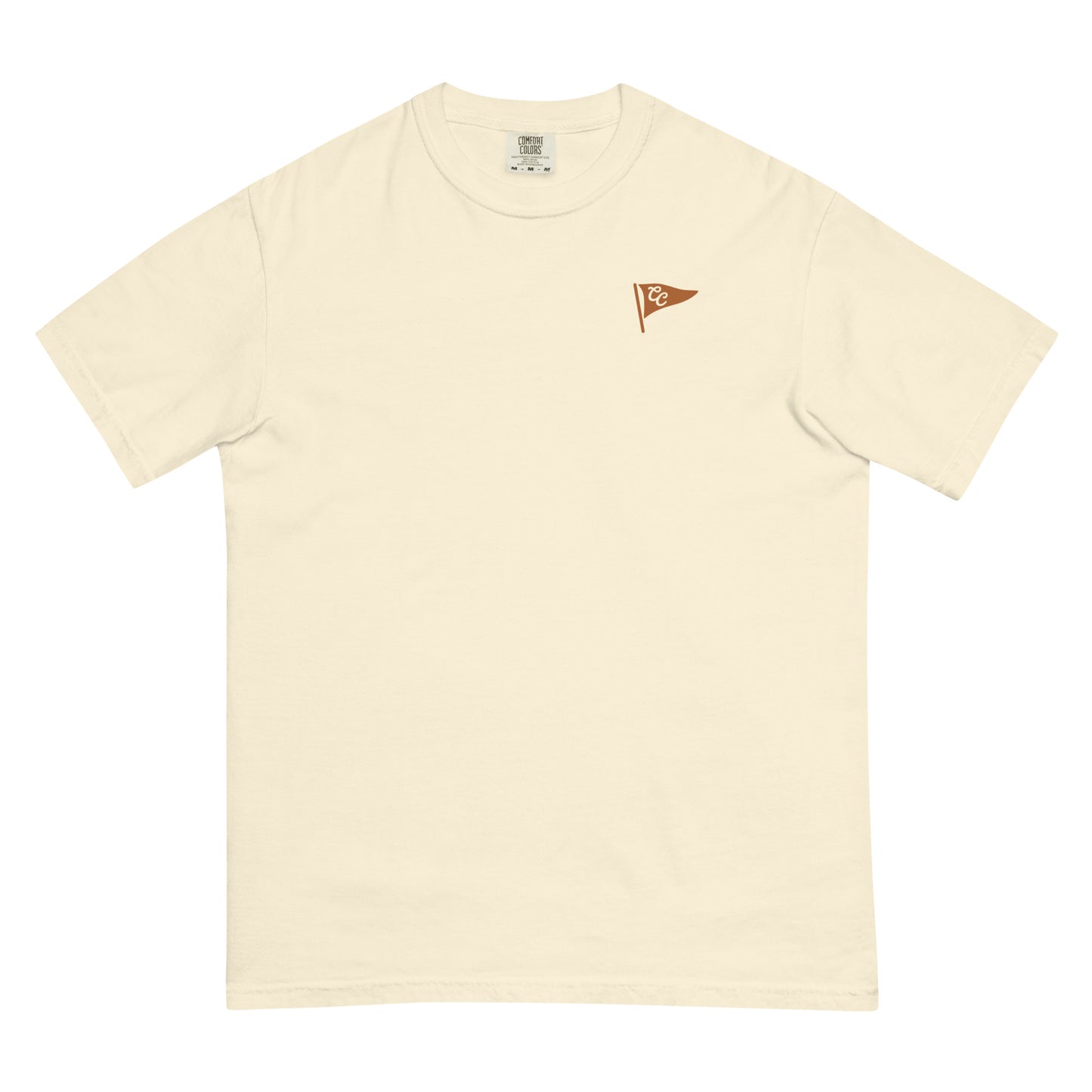 A cream-colored short-sleeve crewneck t-shirt with a small brown flag graphic on the left chest, displayed flat against a white background.